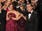 Stephen Colbert, center, and he team from "The Late Show with Stephen Colbert" accept the award for outstanding talk series during the 77th Primetime Emmy Awards.