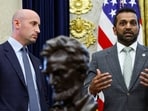 FBI Director Kash Patel speaks and White House Deputy Chief of Staff Stephen Miller listens during an event.