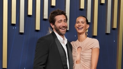 Jake Gyllenhaal, left, and Jeanne Cadieu arrive at the 77th Primetime Emmy Awards on Sunday, Sept. 14, 2025, at the Peacock Theater in Los Angeles. (AP Photo/Jae C. Hong) (Jae C. Hong/Invision/AP)