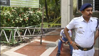 A policeman stands near the spot where the female student was found dead at the Jadavpur University campus, in Kolkata. (PTI) A policeman stands near the spot where the female student was found dead at the Jadavpur University campus, in Kolkata. (PTI)
