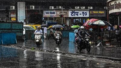 Bike riders at the Elphinstone Bridge amid heavy rainfall. (HT Photo) Bike riders at the Elphinstone Bridge amid heavy rainfall. (HT Photo)