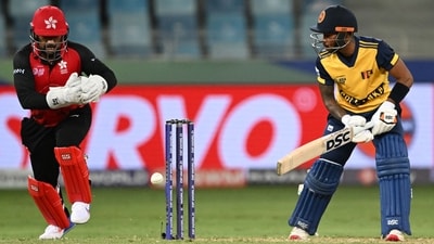 Pathum Nissanka plays a shot as Hong Kong wicketkeeper Zeeshan Ali fields the ball. (AFP)