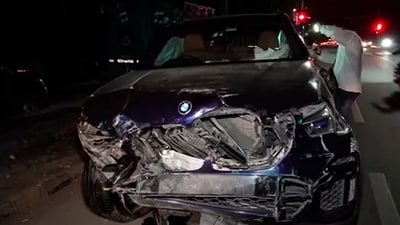 Wreckage of the BMW car lies on a road after the accident in New Delhi in which a senior official of the finance ministry, who was on a motorcycle, was killed and three people, including his wife, were injured, near the Delhi Cantonment metro station on Ring Road on Sunday. (PTI) Wreckage of the BMW car lies on a road after the accident in New Delhi in which a senior official of the finance ministry, who was on a motorcycle, was killed and three people, including his wife, were injured, near the Delhi Cantonment metro station on Ring Road on Sunday. (PTI)