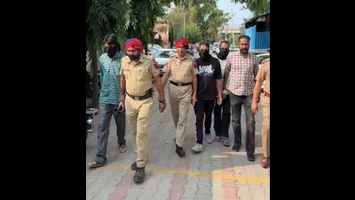 The arrested accused in Mohali police custody on Monday. (HT Photo) The arrested accused in Mohali police custody on Monday. (HT Photo)