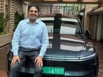 Inox Group’s Siddharth Jain poses with his Tesla Model Y