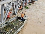 NDRF personnel clearing the hyacinth below the Gidderpindi railway bridge when the flow of Sutlej was at its peak in early September. (HT File) NDRF personnel clearing the hyacinth below the Gidderpindi railway bridge when the flow of Sutlej was at its peak in early September. (HT File)