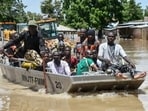 (Representative image) People affected by floods are escorted through flood water on a military boat in Nigeria's Maiduguri.
