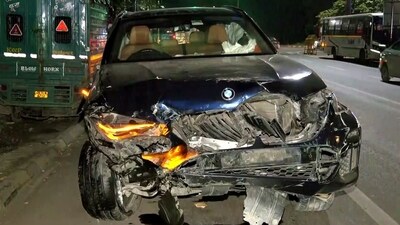 The BMW car, which collided with a couple riding motorcycle, the husband died, and the wife sustained the injuries in Dhaula Kuan. (ANI) The BMW car, which collided with a couple riding motorcycle, the husband died, and the wife sustained the injuries in Dhaula Kuan. (ANI)