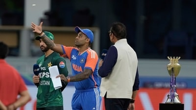 Pakistan's captain Salman Agha, left, watches as India's captain Suryakumar Yadav flips the coin at the toss ahead of the Asia Cup match between (AP) Pakistan's captain Salman Agha, left, watches as India's captain Suryakumar Yadav flips the coin at the toss ahead of the Asia Cup match between (AP)