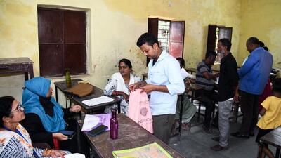 Booth Level Officer (BLO) verifies the documents of voters during the ongoing special intensive revision camp of electoral rolls, in Patna (ANI FILE PHOTO) Booth Level Officer (BLO) verifies the documents of voters during the ongoing special intensive revision camp of electoral rolls, in Patna (ANI FILE PHOTO)