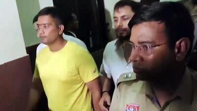Chaitanya Baghel (in yellow), the son of former Chhattisgarh chief minister and Congress leader Bhupesh Baghel, after his arrest. (ANI File Photo) Chaitanya Baghel (in yellow), the son of former Chhattisgarh chief minister and Congress leader Bhupesh Baghel, after his arrest. (ANI File Photo)
