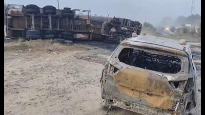 Charred remains of a car that collided with a burning chemical tanker in Rewari on Monday night. (PTI)