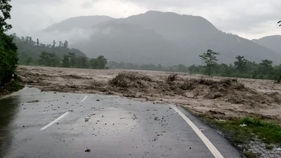 A road was destroyed by flooding water near Dehradun's Maldevta after a cloudburst and heavy rainfall. (PTI) A road was destroyed by flooding water near Dehradun's Maldevta after a cloudburst and heavy rainfall. (PTI)