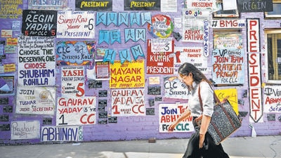 Election campaign posters plastered on a wall at DU’s North Campus. (Sanchit Khanna/HT Photo)