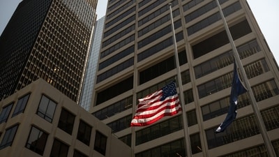 Flags fly at half mast at the scene of a shooting from Monday in New York, US, (Bloomberg) Flags fly at half mast at the scene of a shooting from Monday in New York, US, (Bloomberg)