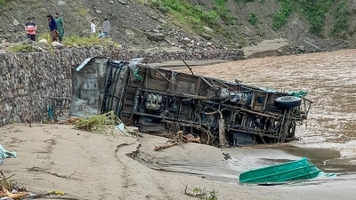 A vehicle damaged due to floods triggered by heavy rain at Dharampur in Mandi, Himachal Pradesh, on Tuesday. (PTI) A vehicle damaged due to floods triggered by heavy rain at Dharampur in Mandi, Himachal Pradesh, on Tuesday. (PTI)