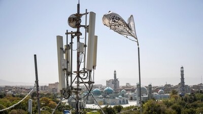 A Taliban flag flutters near telecom equipment installed over a rooftop providing internet services overlooking Hazrat-e-Ali Shrine, or Blue Mosque, in Mazar-i-Sharif on September 16, 2025. (AFP) A Taliban flag flutters near telecom equipment installed over a rooftop providing internet services overlooking Hazrat-e-Ali Shrine, or Blue Mosque, in Mazar-i-Sharif on September 16, 2025. (AFP)