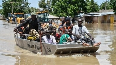 (Representative image) People affected by floods are escorted through flood water on a military boat in Nigeria's Maiduguri. (AFP) (Representative image) People affected by floods are escorted through flood water on a military boat in Nigeria's Maiduguri. (AFP)