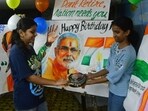 Children celebrate Prime Minister Narendra Modi's birthday with a cake-cutting ceremony at Lalbaug, in Mumbai, India, on Tuesday. (Bhushan Koyande/HT Photo)