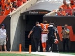 Cincinnati Bengals quarterback Joe Burrow (9) is assisted to the locker room with an injury.