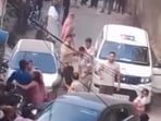 Locals purportedly filmed the incident as the police team was attacked in the middle of a street.