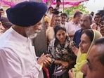 Union minister of state Raksha Khadse and former MP Preneet Kaur visit a flood-affected area at Dharamheri village in Patiala district, Tuesday. (PTI)