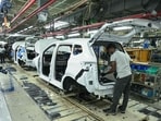 An employee works in a car assembly line at the joint manufacturing facility of Renault Nissan Automotive India, in Oragadam, an industrial suburb of Chennai(AFP FILE)