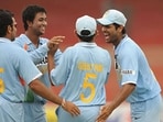 File photo of Pragyan Ojha (L) celebrating with RP Singh (R) and Gautam Gambhir (C)
