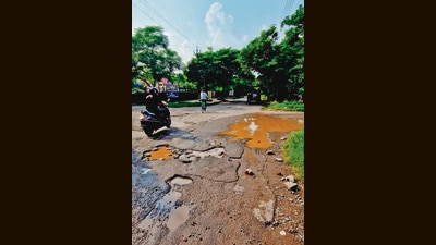 A pothole-riddled road right behind Panchkula municipal corporation’s office in Sector 14. (HT Photo) A pothole-riddled road right behind Panchkula municipal corporation’s office in Sector 14. (HT Photo)