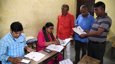 A Booth Level Officer (BLO) verifies the documents of voters during the special intensive revision camp of electoral rolls, in Patna (ANI FILE PHOTO) A Booth Level Officer (BLO) verifies the documents of voters during the special intensive revision camp of electoral rolls, in Patna (ANI FILE PHOTO)