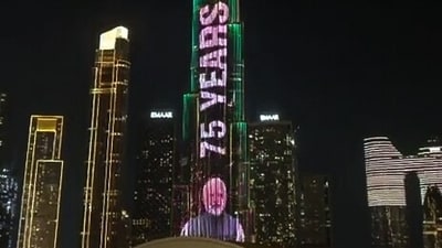 The dazzling display drew attention from visitors and residents in Dubai, who captured the moment as the landmark shone with visuals honouring the Indian leader. (ANI Grab )