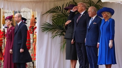President Donald Trump salutes as he stands beside Britain's King Charles III and Queen Camilla with Melania Trump on the left as Britain's Kate and Prince William listen on the far left during the national anthem at Windsor Castle in Windsor, England, Wednesday, Sept. 17, 2025. AP/PTI(AP09_17_2025_000341A) (AP) President Donald Trump salutes as he stands beside Britain's King Charles III and Queen Camilla with Melania Trump on the left as Britain's Kate and Prince William listen on the far left during the national anthem at Windsor Castle in Windsor, England, Wednesday, Sept. 17, 2025. AP/PTI(AP09_17_2025_000341A) (AP)