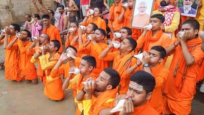 In Varanasi's Dashashwamedh Ghat, young ascetics blow the shankh or the conch shell as they pray for the well-being of PM Modi on his 75th birthday. (PTI) In Varanasi's Dashashwamedh Ghat, young ascetics blow the shankh or the conch shell as they pray for the well-being of PM Modi on his 75th birthday. (PTI)