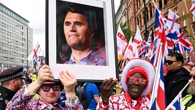 Protesters hold a picture of U.S. conservative activist Charlie Kirk, who was fatally shot while speaking at an event at Utah Valley University, on the day of an anti-immigration rally organised by British anti-immigration activist Stephen Yaxley-Lennon, also known as Tommy Robinson, in London, Britain, September 13, 2025. REUTERS/Jaimi Joy (REUTERS)
