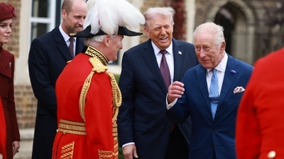 Britain's King Charles III reacts as he greets US President Donald Trump, accompanied by Britain's Prince William, Prince of Wales and Britain's Catherine, Princess of Wales, upon their arrival in the grounds of Windsor Castle, in Windsor, on September 17, 2025, for the start of a second State Visit. US President Donald Trump arrived in Britain for an unprecedented second State Visit, with the UK government rolling out a royal red carpet welcome to win over the mercurial leader. (Photo by Ian Vogler / POOL / AFP) (AFP) Britain's King Charles III reacts as he greets US President Donald Trump, accompanied by Britain's Prince William, Prince of Wales and Britain's Catherine, Princess of Wales, upon their arrival in the grounds of Windsor Castle, in Windsor, on September 17, 2025, for the start of a second State Visit. US President Donald Trump arrived in Britain for an unprecedented second State Visit, with the UK government rolling out a royal red carpet welcome to win over the mercurial leader. (Photo by Ian Vogler / POOL / AFP) (AFP)