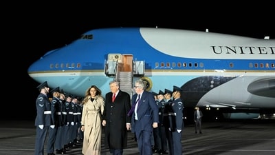 US President Donald Trump (C) and US First Lady Melania Trump disembark from Air Force One after landing at Stansted Airport, eastern England, on September 16, 2025, on the first day of a two-day visit to the UK. US President Donald Trump arrived in the UK late Tuesday for a State Visit with his wife, Melania, a rare privilege made at the invitation of King Charles III. (Photo by ANDREW CABALLERO-REYNOLDS / AFP) (AFP)