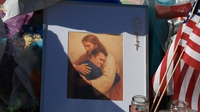 Items are seen in a makeshift memorial for Charlie Kirk at the headquarters of Turning Point USA (Getty Images via AFP) Items are seen in a makeshift memorial for Charlie Kirk at the headquarters of Turning Point USA (Getty Images via AFP)