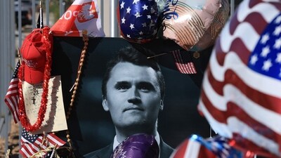 A photograph of Charlie Kirk is seen in a makeshift memorial outside of the headquarters of Turning Point USA on September 16 (Getty Images via AFP) A photograph of Charlie Kirk is seen in a makeshift memorial outside of the headquarters of Turning Point USA on September 16 (Getty Images via AFP)