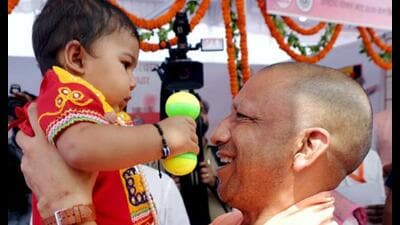 Chief minister Yogi Adityanath plays with a toddler during the launch of the nationwide ‘Swasth Nari, Sashakt Parivar Abhiyaan’, in Lucknow, Wednesday (PTI Photo)) Chief minister Yogi Adityanath plays with a toddler during the launch of the nationwide ‘Swasth Nari, Sashakt Parivar Abhiyaan’, in Lucknow, Wednesday (PTI Photo))