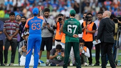 Pakistan's captain Salman Agha, right, watches as India's captain Suryakumar Yadav flips the coin at the toss ahead of the Asia Cup cricket match between India and Pakistan at Dubai International Cricket Stadium (AP) Pakistan's captain Salman Agha, right, watches as India's captain Suryakumar Yadav flips the coin at the toss ahead of the Asia Cup cricket match between India and Pakistan at Dubai International Cricket Stadium (AP)