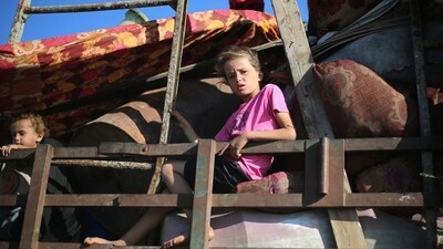 A displaced Palestinian girl sits in the back of a truck as she and her family move with their belongings southwards on a road in the Nuseirat refugee camp area in the central Gaza Strip following renewed Israeli evacuation orders for Gaza City on September 16, 2025. (Eyad Baba/AFP) A displaced Palestinian girl sits in the back of a truck as she and her family move with their belongings southwards on a road in the Nuseirat refugee camp area in the central Gaza Strip following renewed Israeli evacuation orders for Gaza City on September 16, 2025. (Eyad Baba/AFP)
