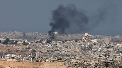 This picture taken from a position at Israel's border with the Gaza Strip shows smoke billowing amid Israeli bombardment of the besieged Palestinian territory. (Menahem Kahana/AFP) This picture taken from a position at Israel's border with the Gaza Strip shows smoke billowing amid Israeli bombardment of the besieged Palestinian territory. (Menahem Kahana/AFP)