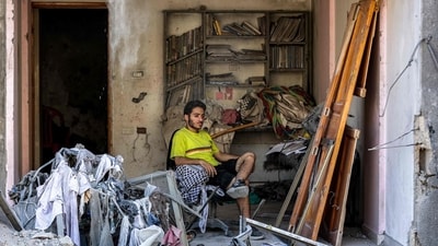 A man sits in an exposed room in a heavily damaged building near the Unknown Soldier Tower, which was destroyed by overnight Israeli bombardment, in the Rimal neighbourhood of Gaza City on September 15, 2025. (Omar al-Qattaa/AFP) A man sits in an exposed room in a heavily damaged building near the Unknown Soldier Tower, which was destroyed by overnight Israeli bombardment, in the Rimal neighbourhood of Gaza City on September 15, 2025. (Omar al-Qattaa/AFP)