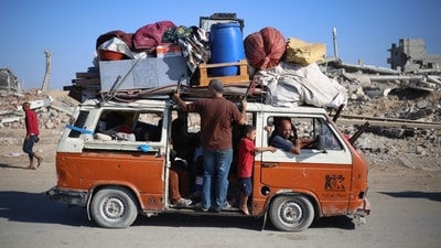 Displaced Palestinians move with their belongings southwards on a road in the Nuseirat refugee camp area in the central Gaza Strip following renewed Israeli evacuation orders for Gaza City on September 16, 2025. (Eyad Baba/AFP) Displaced Palestinians move with their belongings southwards on a road in the Nuseirat refugee camp area in the central Gaza Strip following renewed Israeli evacuation orders for Gaza City on September 16, 2025. (Eyad Baba/AFP)