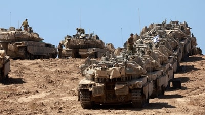 A convoy of Israeli tanks is deployed at Israel's border with the Gaza Strip on September 16, 2025. (Menahem Kahana/AFP) A convoy of Israeli tanks is deployed at Israel's border with the Gaza Strip on September 16, 2025. (Menahem Kahana/AFP)