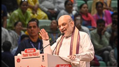 Home Minister Amit Shah during the launch ceremony of various development projects for Delhi on the occasion of Prime Minister Narendra Modi's 75th Birthday at Thyagaraj Stadium in New Delhi on Wednesday. (Sanchit Khanna/ Hindustan Times) Home Minister Amit Shah during the launch ceremony of various development projects for Delhi on the occasion of Prime Minister Narendra Modi's 75th Birthday at Thyagaraj Stadium in New Delhi on Wednesday. (Sanchit Khanna/ Hindustan Times)