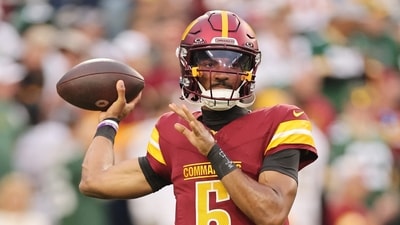 Jayden Daniels #5 of the Washington Commanders warms up prior to the game against the Green Bay Packers (Getty Images via AFP) Jayden Daniels #5 of the Washington Commanders warms up prior to the game against the Green Bay Packers (Getty Images via AFP)