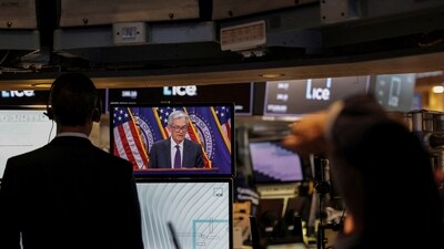 Traders work as a TV broadcasts a press conference by US Federal Reserve Chair Jerome Powell following the Fed rate announcement, on the floor of the NYSE in New York on 30 July 2025. (Reuters/File Photo)