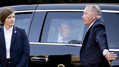 US President Donald Trump (C) sits in his car "The Beast" (AFP) US President Donald Trump (C) sits in his car "The Beast" (AFP)