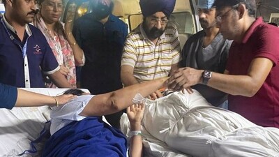 Sandeep Kaur, the injured wife of department of economic affairs deputy secretary Navjot Singh, bids farewell to her husband's mortal remains before his body was taken for cremation, at a hospital in New Delhi, on Tuesday, (PTI) Sandeep Kaur, the injured wife of department of economic affairs deputy secretary Navjot Singh, bids farewell to her husband's mortal remains before his body was taken for cremation, at a hospital in New Delhi, on Tuesday, (PTI)